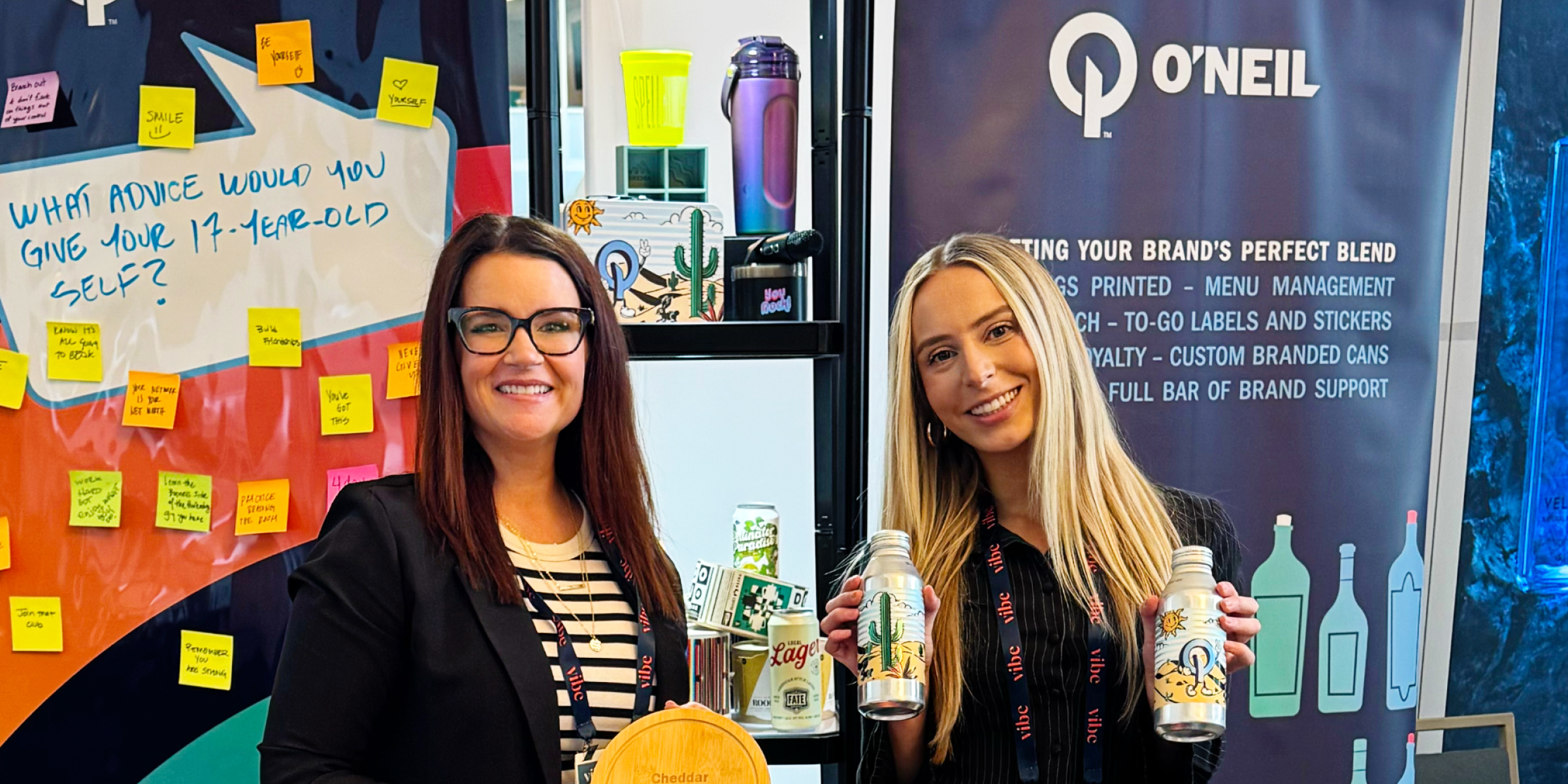 Natalie and Hannah at the VIBE Conference Booth