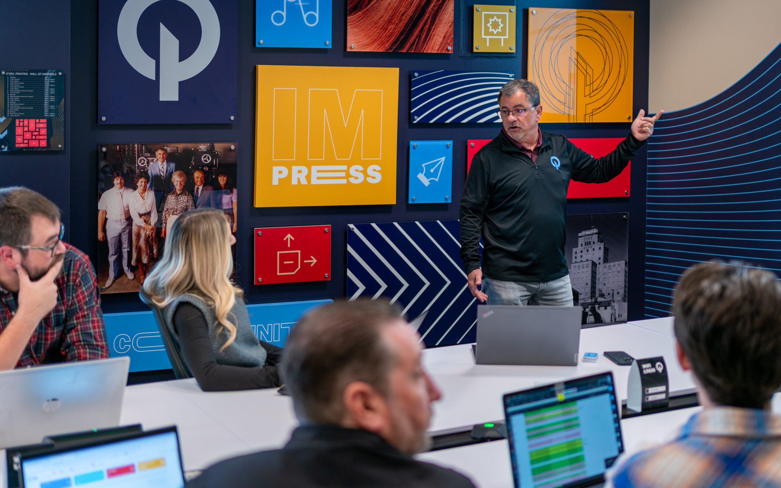 Dean leading meeting in conference room