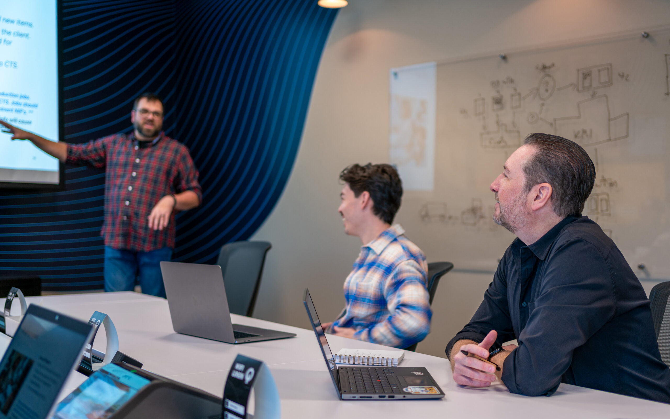 Drew and Aaron meeting in conference room