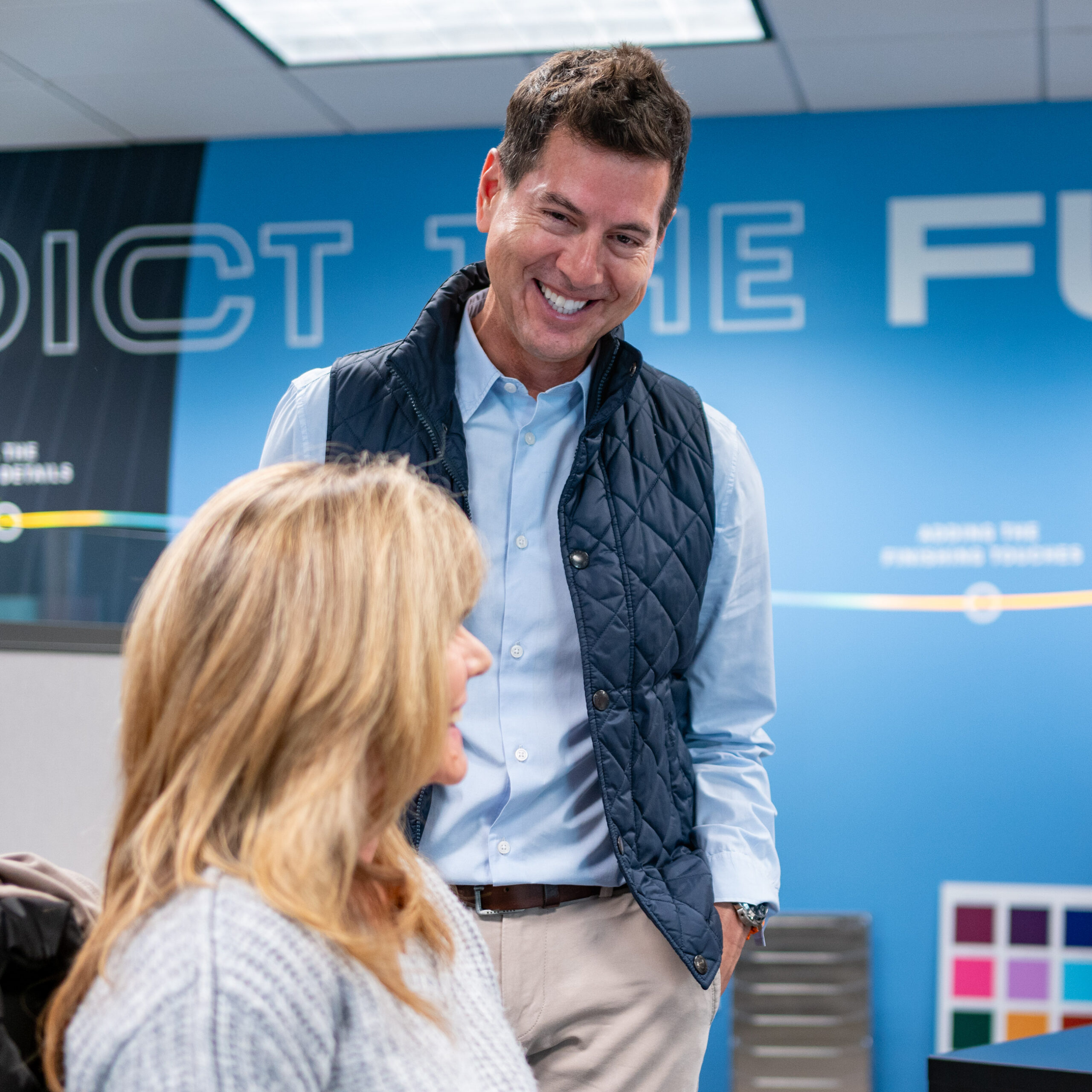 Simon and Karen talking in the sales office