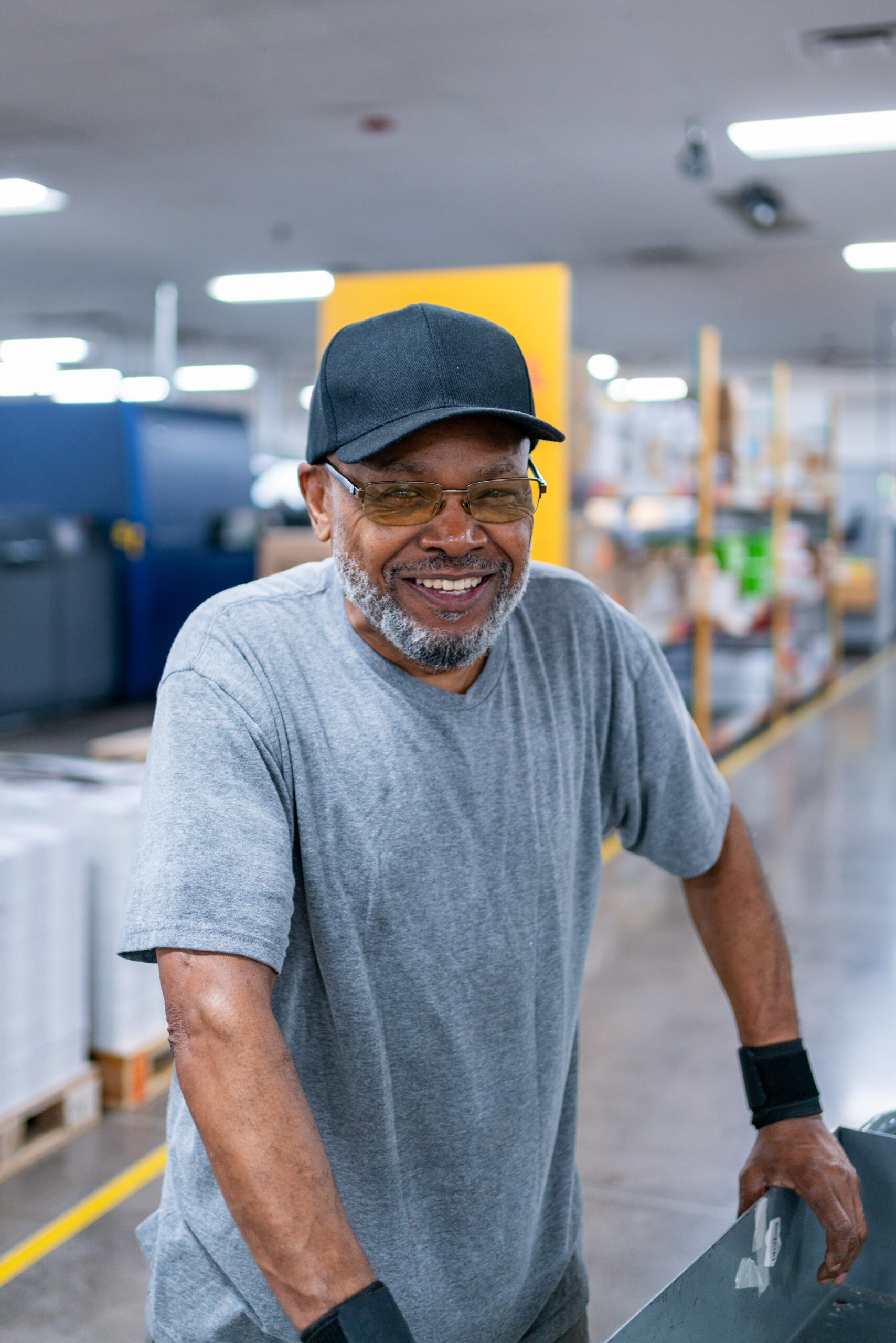 Production employee smiling