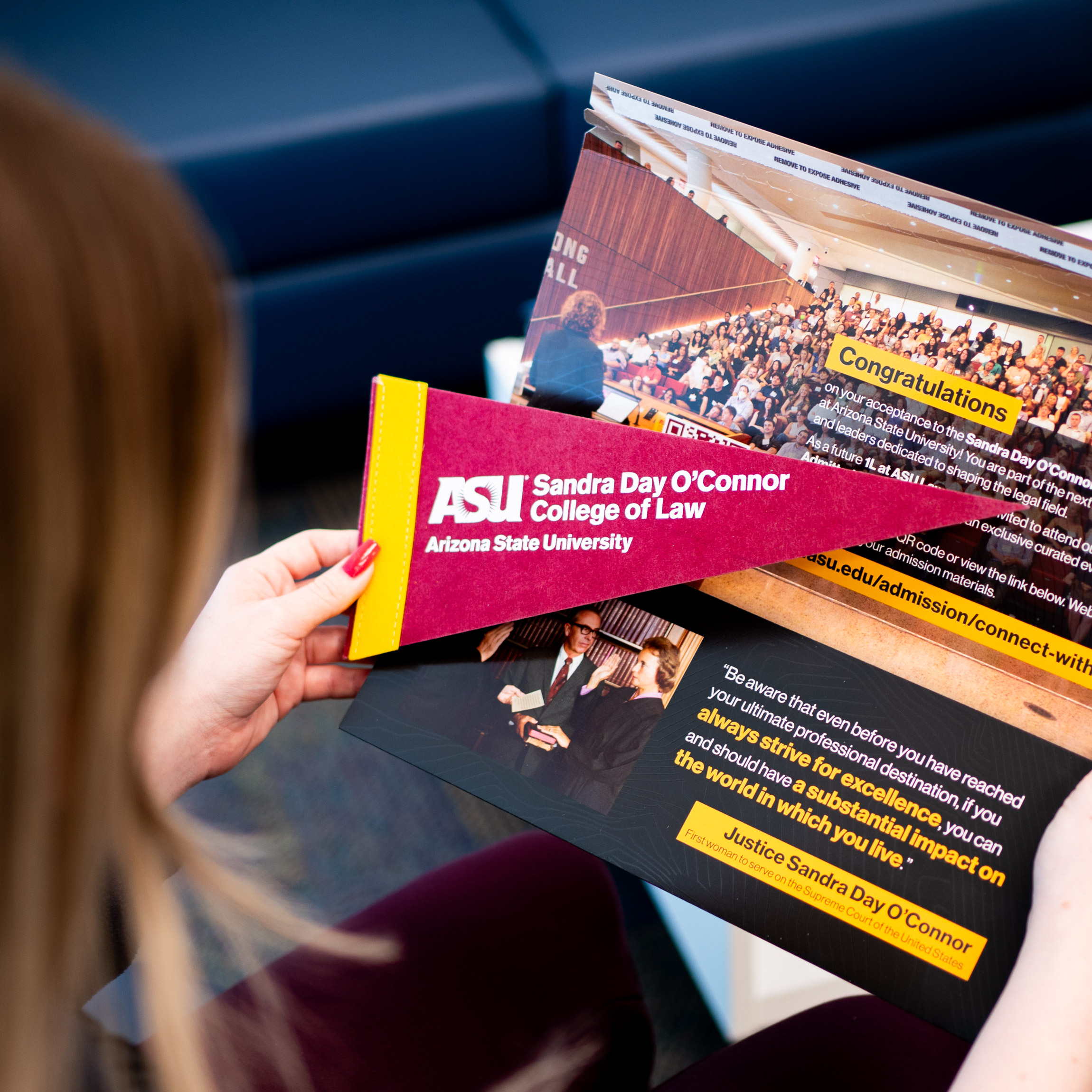 A student looking at their ASU admissions acceptance packet