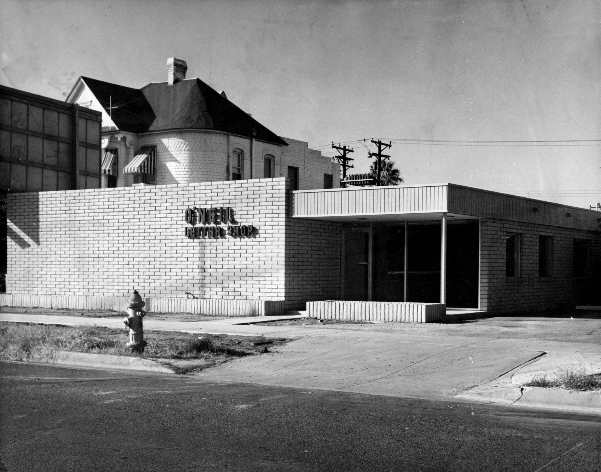 Black and white historical photo of O'Neil building entrance