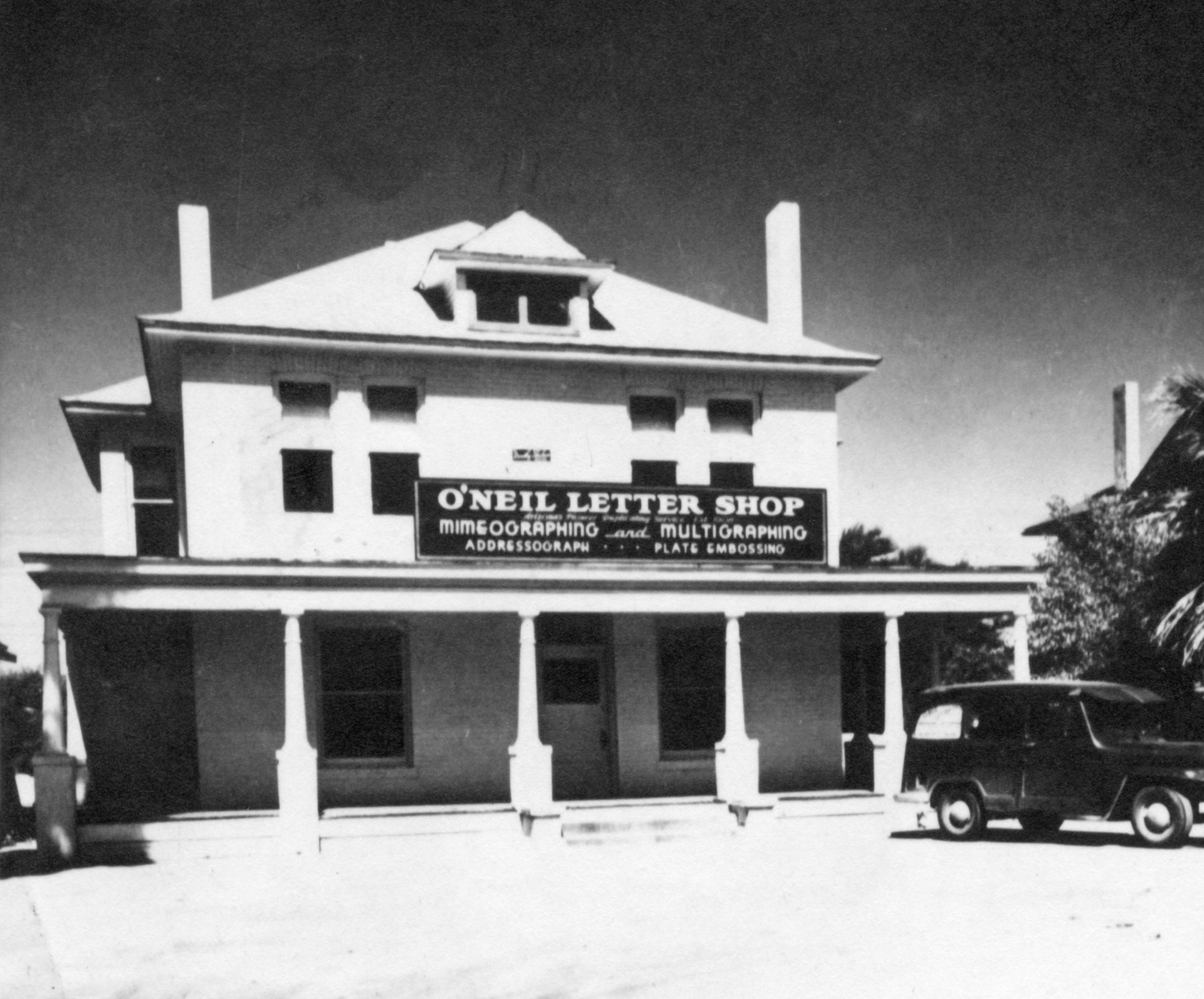 Historical black and white photo of O'Neil Letter Shop exterior