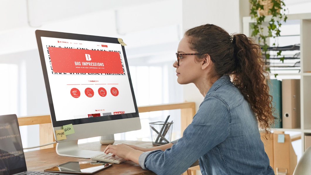 Woman at computer looking at online brand storefront