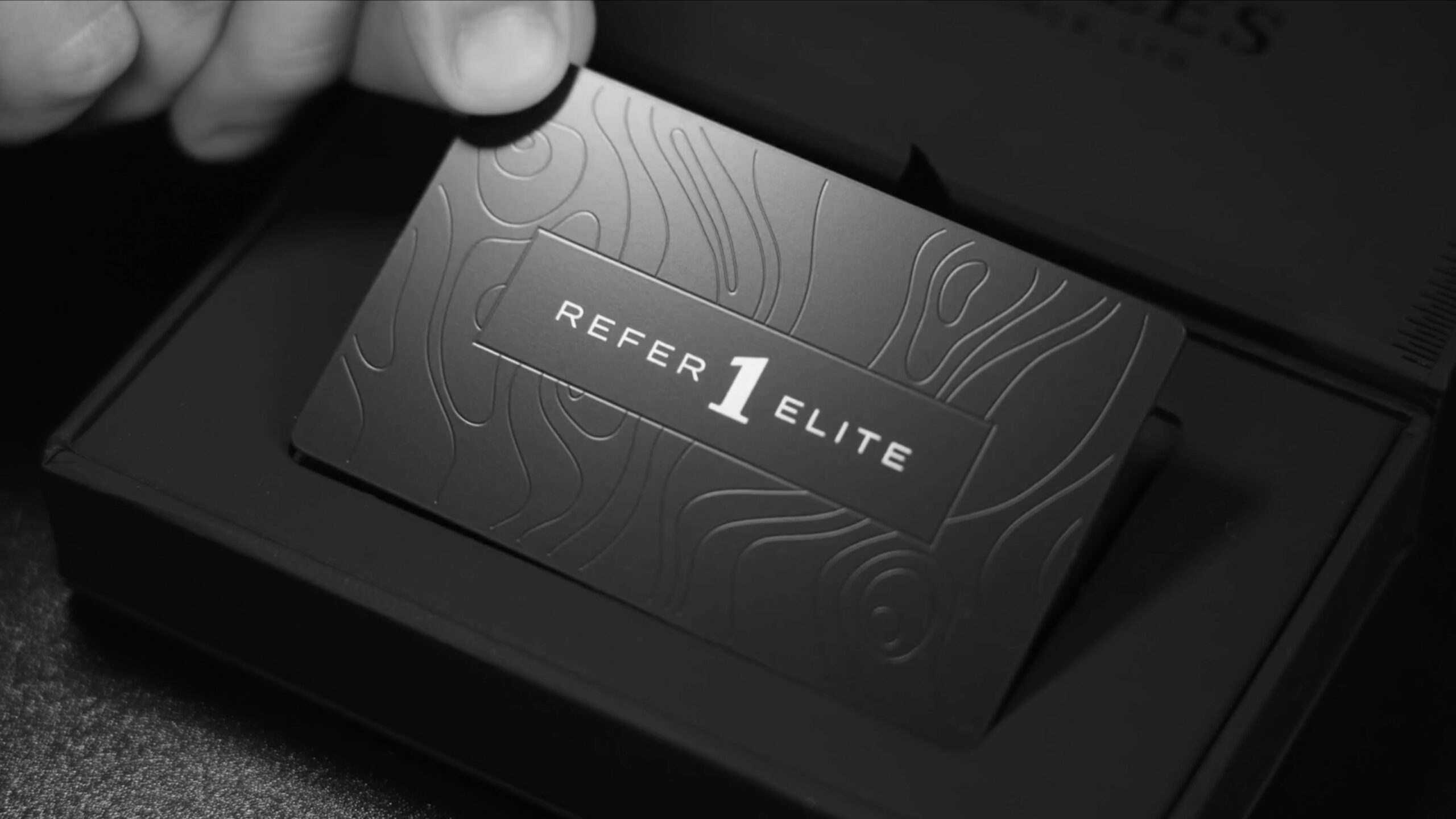 Refer1 Elite Program video still of man pulling the card out of the box