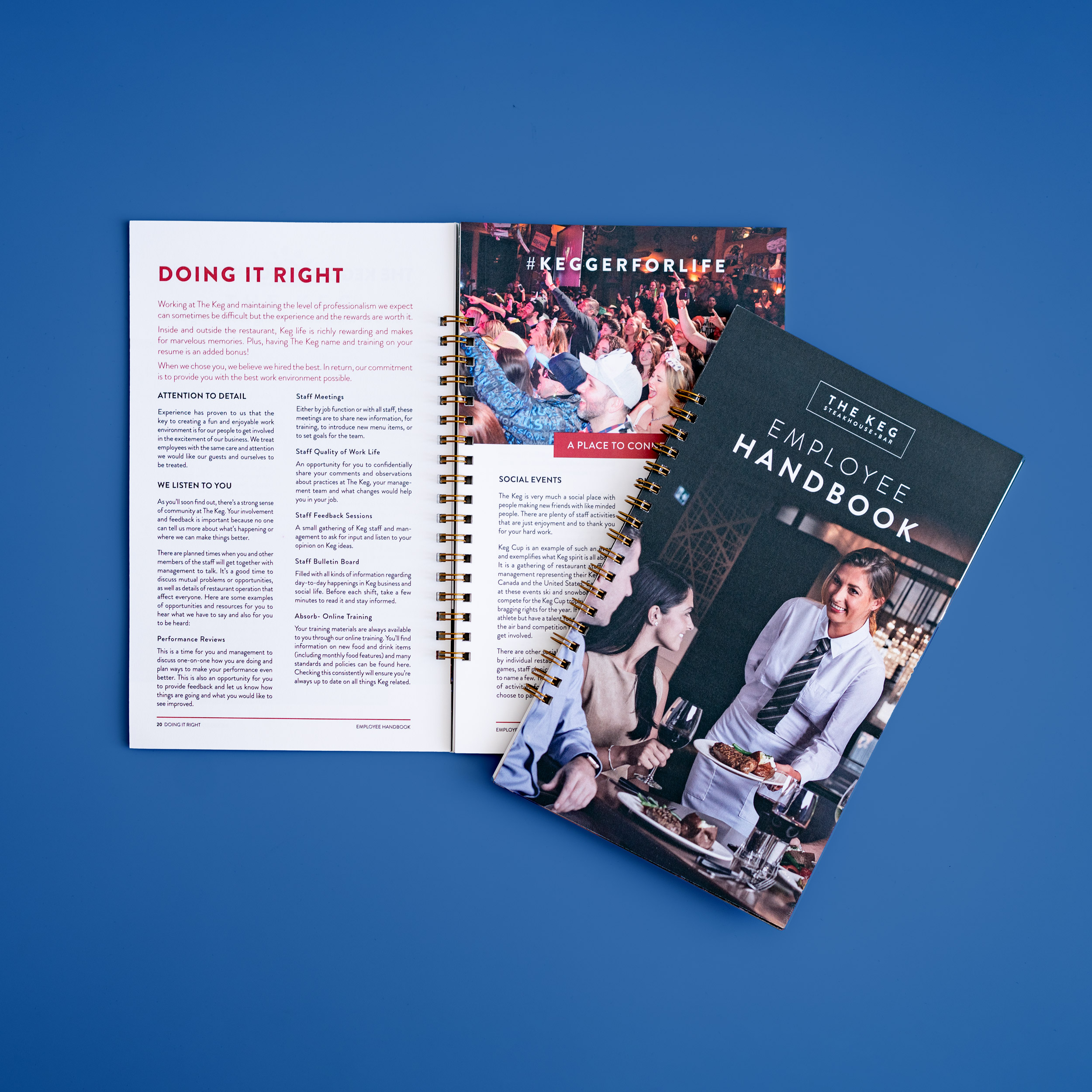 The Keg employee handbook on a blue background