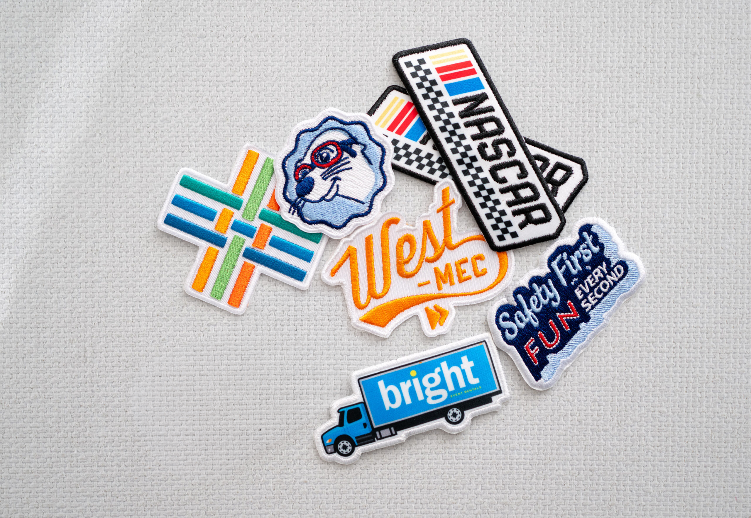 Various embroidered patches on a white background