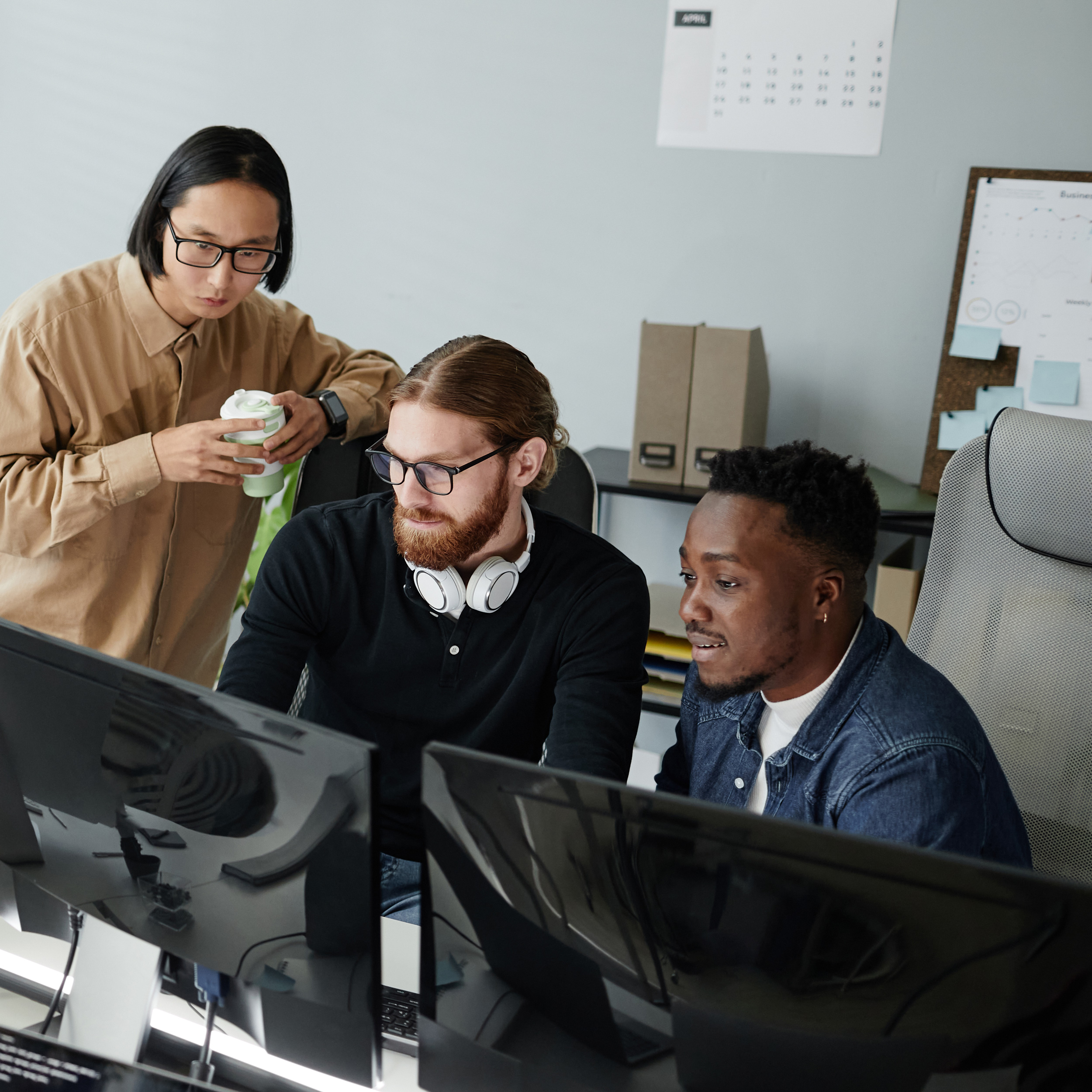 Team of tech workers collaborating in an office
