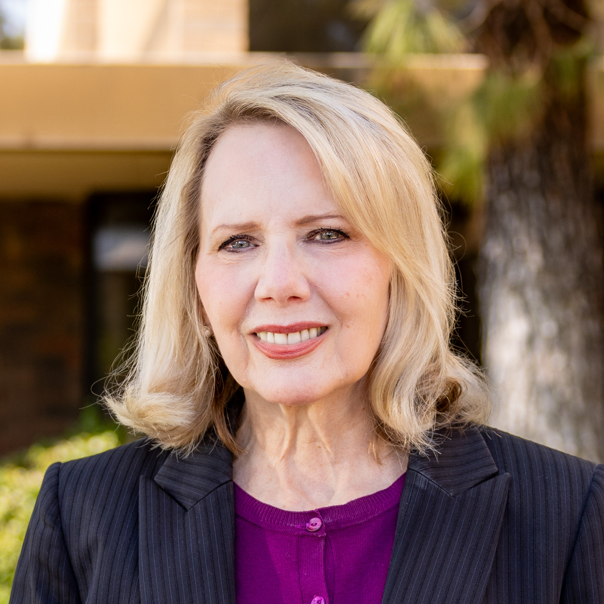 Connie smiling outdoors