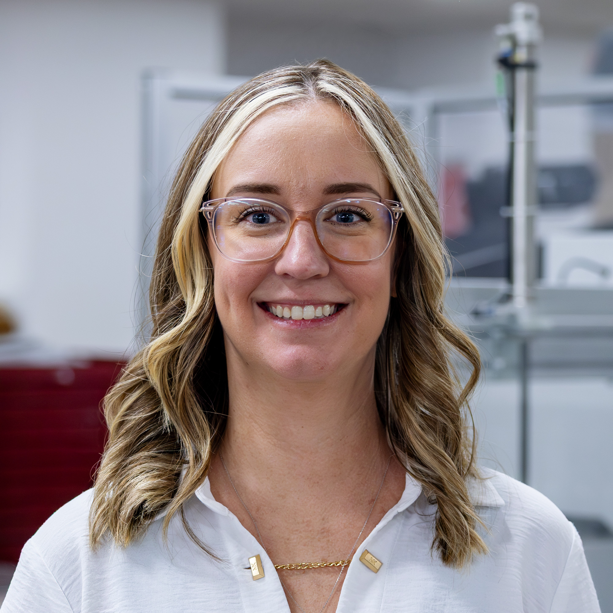 Jenilee smiling on the production floor
